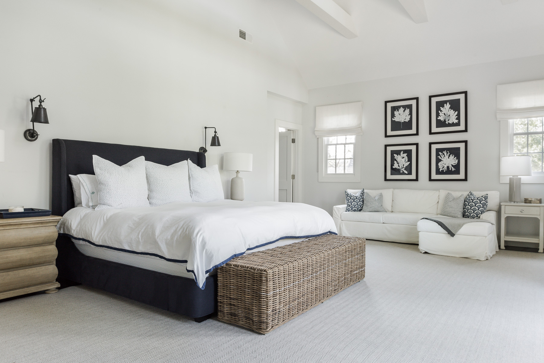 Primary bedroom with navy upholstered bed